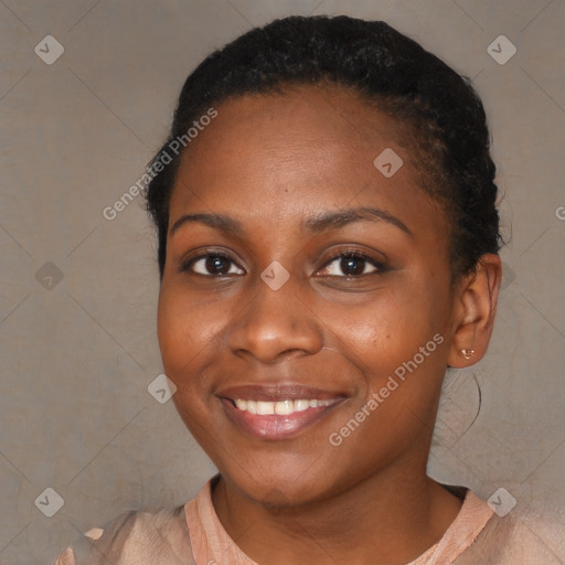 Joyful black young-adult female with short  brown hair and brown eyes