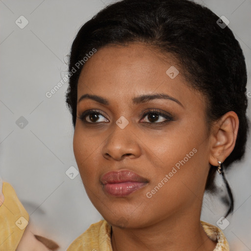 Joyful black young-adult female with medium  brown hair and brown eyes