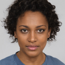 Neutral black young-adult female with short  brown hair and brown eyes