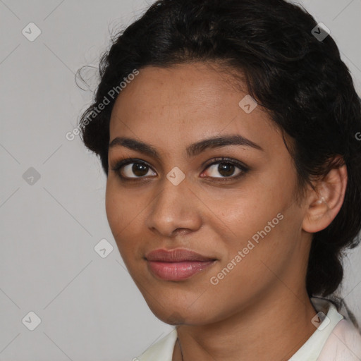 Joyful latino young-adult female with medium  brown hair and brown eyes