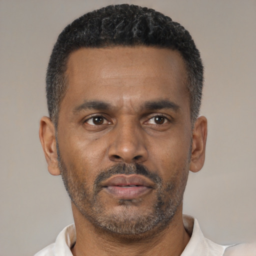 Neutral latino adult male with short  black hair and brown eyes