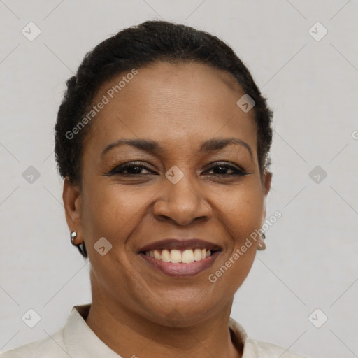 Joyful latino adult female with short  brown hair and brown eyes