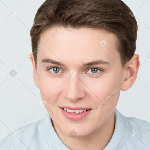 Joyful white young-adult female with short  brown hair and grey eyes