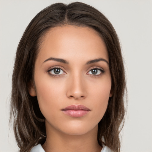 Neutral white young-adult female with long  brown hair and brown eyes