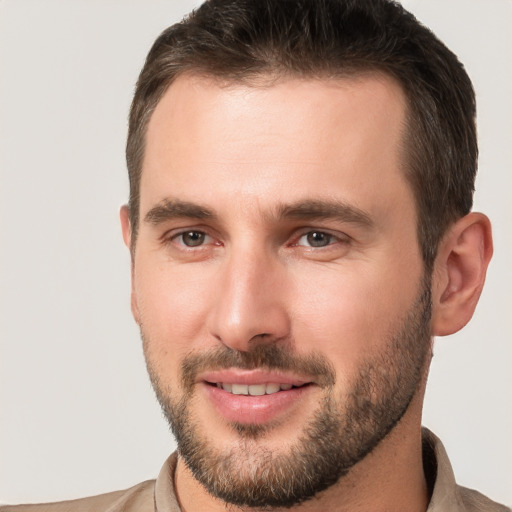 Joyful white young-adult male with short  brown hair and brown eyes