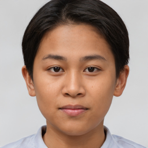Joyful asian young-adult female with short  brown hair and brown eyes