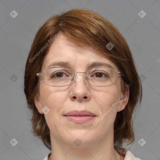 Joyful white adult female with medium  brown hair and blue eyes