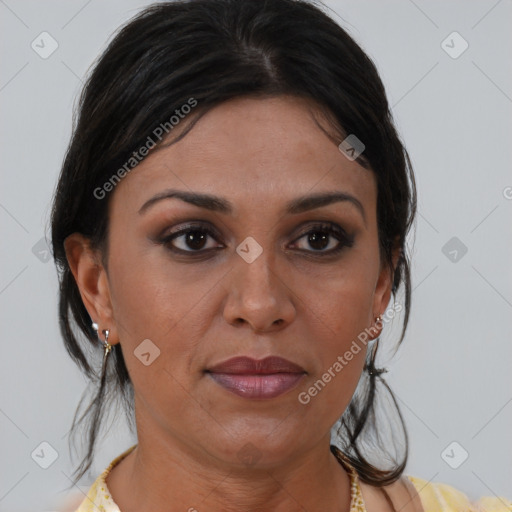 Joyful black adult female with medium  brown hair and brown eyes