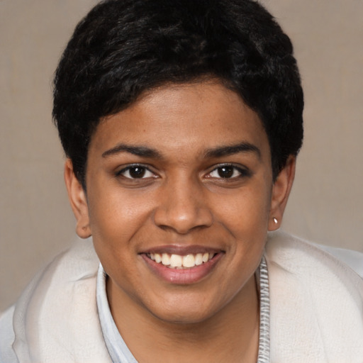 Joyful black young-adult female with short  brown hair and brown eyes