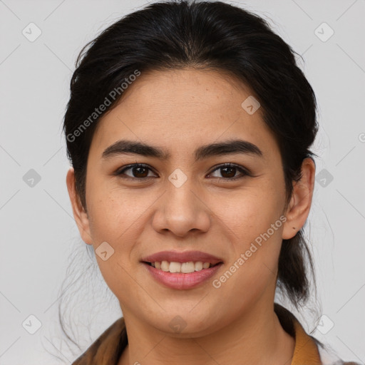 Joyful latino young-adult female with medium  brown hair and brown eyes