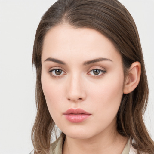 Neutral white young-adult female with long  brown hair and brown eyes