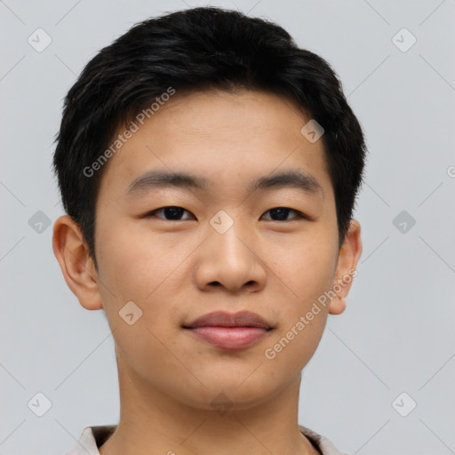 Joyful asian young-adult male with short  black hair and brown eyes