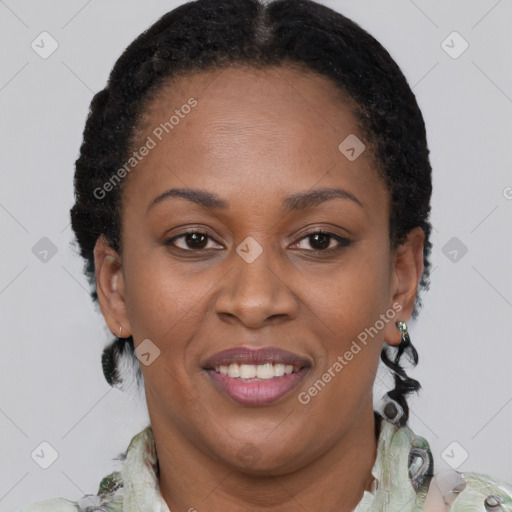 Joyful black adult female with short  brown hair and brown eyes