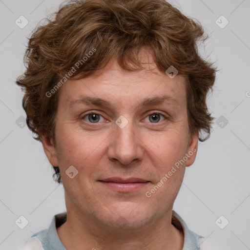 Joyful white adult male with short  brown hair and grey eyes