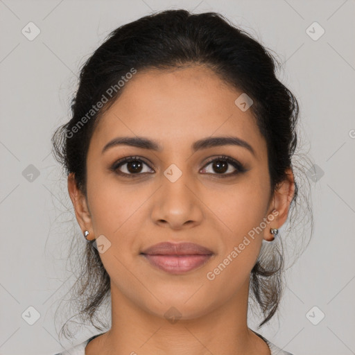 Joyful latino young-adult female with long  brown hair and brown eyes