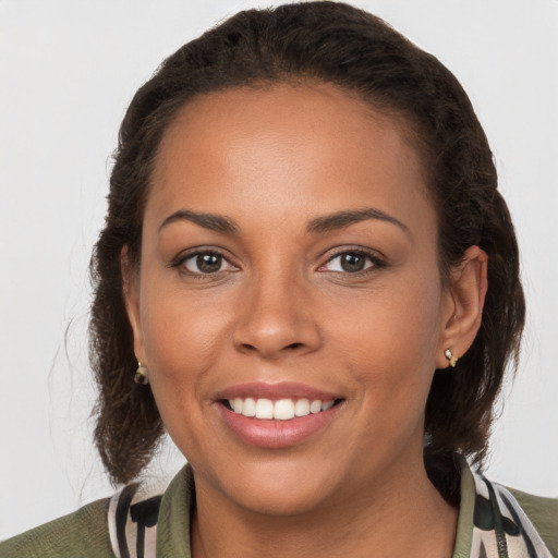 Joyful white young-adult female with medium  brown hair and brown eyes