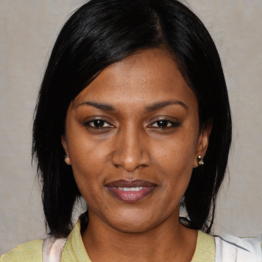 Joyful asian young-adult female with medium  black hair and brown eyes