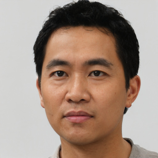 Neutral asian young-adult male with short  black hair and brown eyes