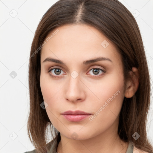 Neutral white young-adult female with long  brown hair and brown eyes