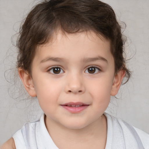 Joyful white child male with medium  brown hair and brown eyes