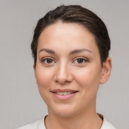 Joyful white young-adult female with short  brown hair and brown eyes