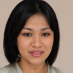 Joyful asian young-adult female with medium  black hair and brown eyes