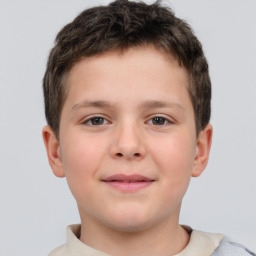 Joyful white child male with short  brown hair and brown eyes