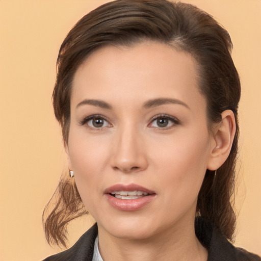 Joyful white young-adult female with medium  brown hair and brown eyes