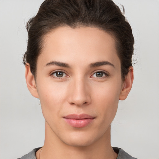 Neutral white young-adult female with short  brown hair and brown eyes