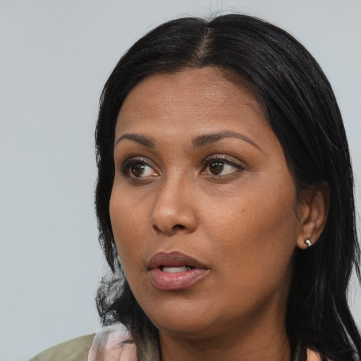 Neutral black adult female with long  black hair and brown eyes