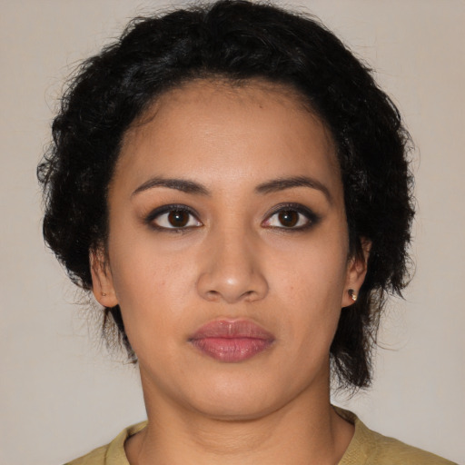 Neutral latino young-adult female with long  black hair and brown eyes