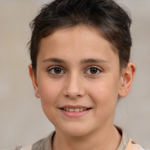 Joyful white child female with short  brown hair and brown eyes