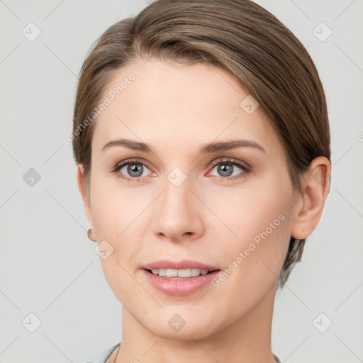 Joyful white young-adult female with short  brown hair and grey eyes