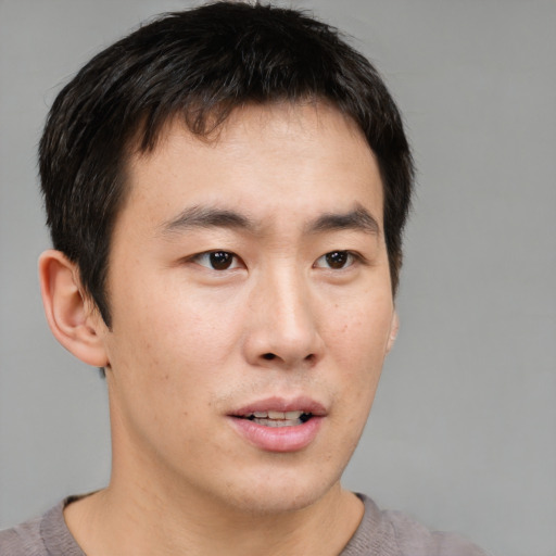 Neutral asian young-adult male with short  brown hair and brown eyes