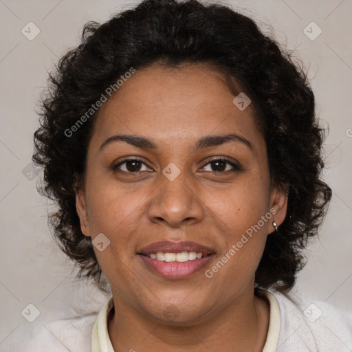 Joyful black adult female with medium  brown hair and brown eyes