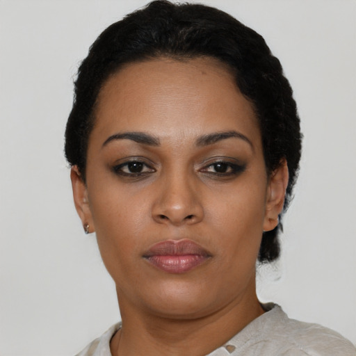 Neutral black young-adult female with short  black hair and brown eyes