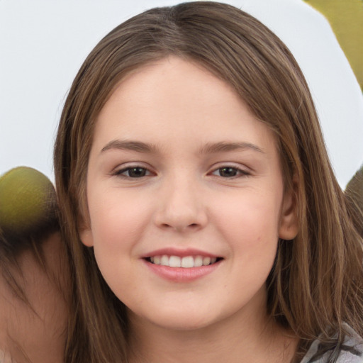 Joyful white child female with long  brown hair and brown eyes