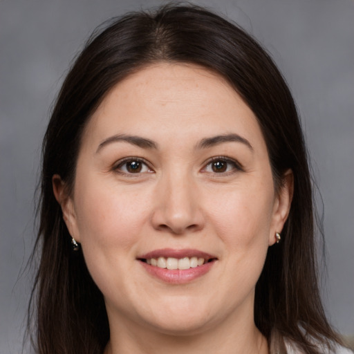 Joyful white young-adult female with medium  brown hair and brown eyes