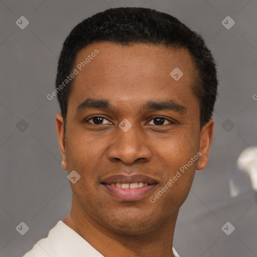 Joyful black young-adult male with short  black hair and brown eyes