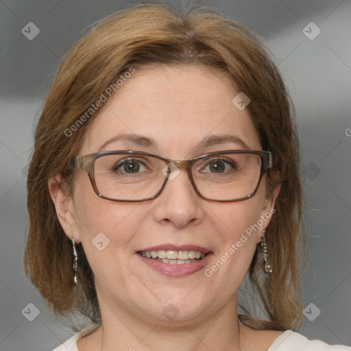 Joyful white adult female with medium  brown hair and blue eyes