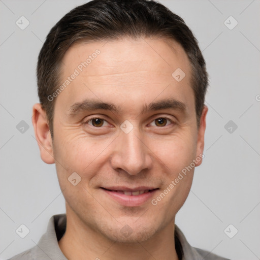 Joyful white young-adult male with short  brown hair and brown eyes