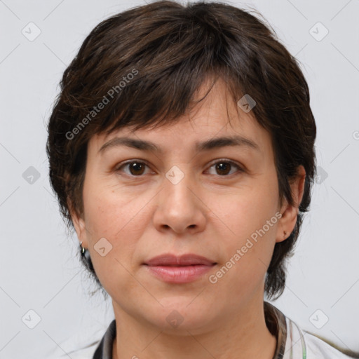 Joyful white adult female with medium  brown hair and brown eyes