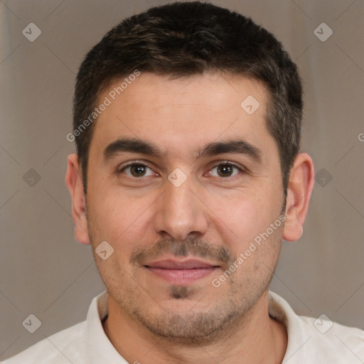 Joyful white adult male with short  brown hair and brown eyes