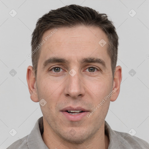 Joyful white adult male with short  brown hair and brown eyes