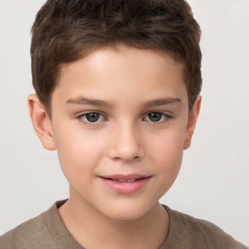 Joyful white child male with short  brown hair and brown eyes