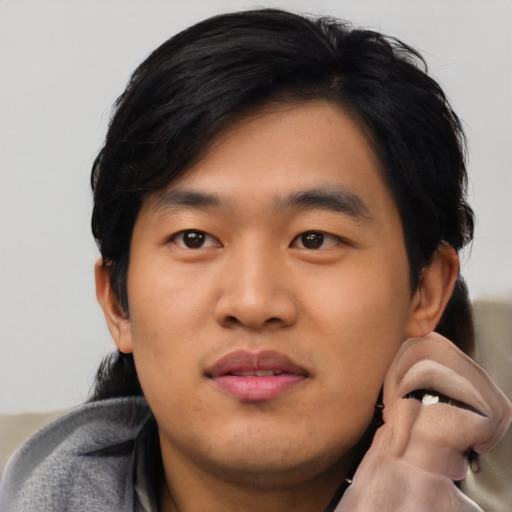 Neutral asian young-adult male with short  black hair and brown eyes