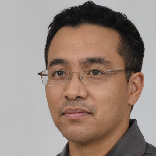 Neutral asian adult male with short  black hair and brown eyes