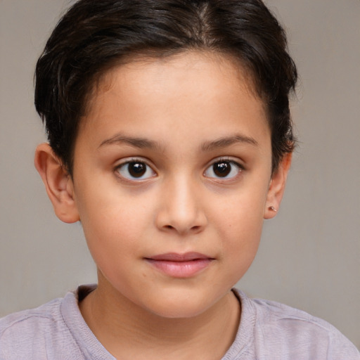 Joyful white child female with short  brown hair and brown eyes