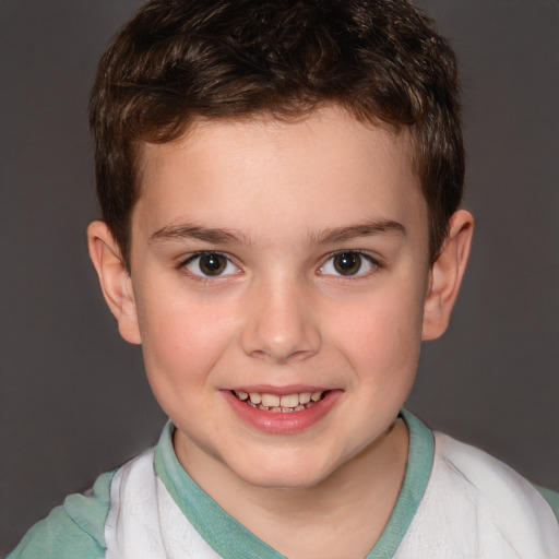 Joyful white child male with short  brown hair and brown eyes