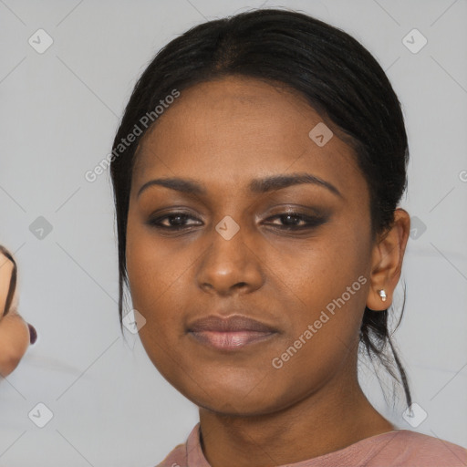 Neutral black young-adult female with medium  black hair and brown eyes